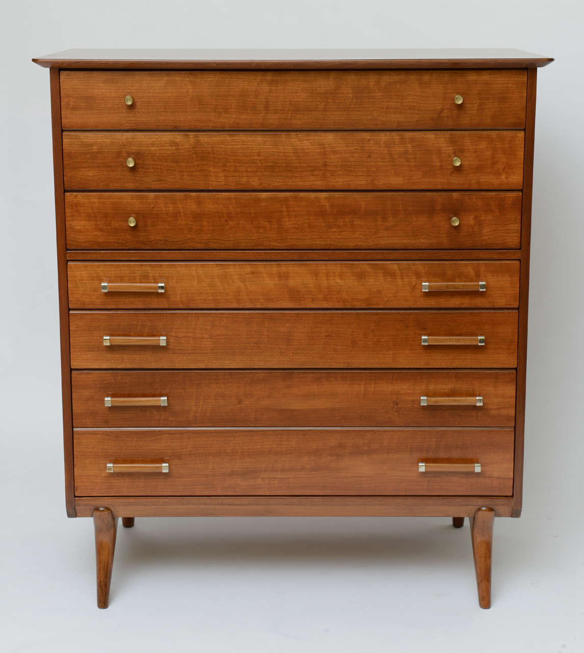 SOLD Beautifully figured cherry wood throughout highlights this chest of drawers or gentleman's chest designed by Renzo Rutili for Johnson Furniture and deftly restored.  Exceptional storage with six wide drawers and one very deep drawer.  The top